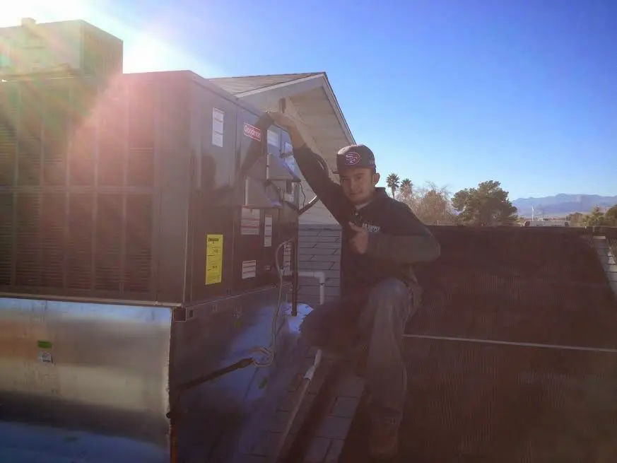 HVAC technician performing HVAC Inspection on a rooftop unit in Cherryville